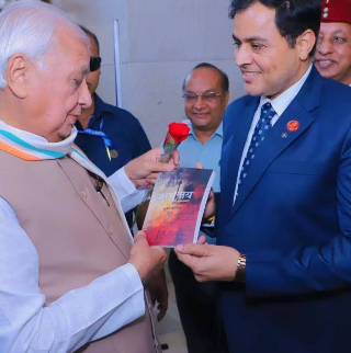 Presenting Mrityunjay to Governor Arif Mohammad Khan